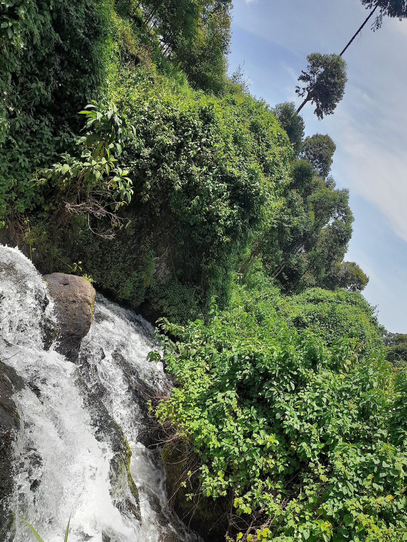 Sipi Falls cascading through the green highlands of eastern Uganda
