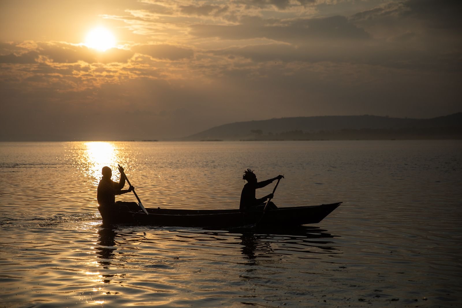 Canoeing at sunset on Lake Victoria, Uganda